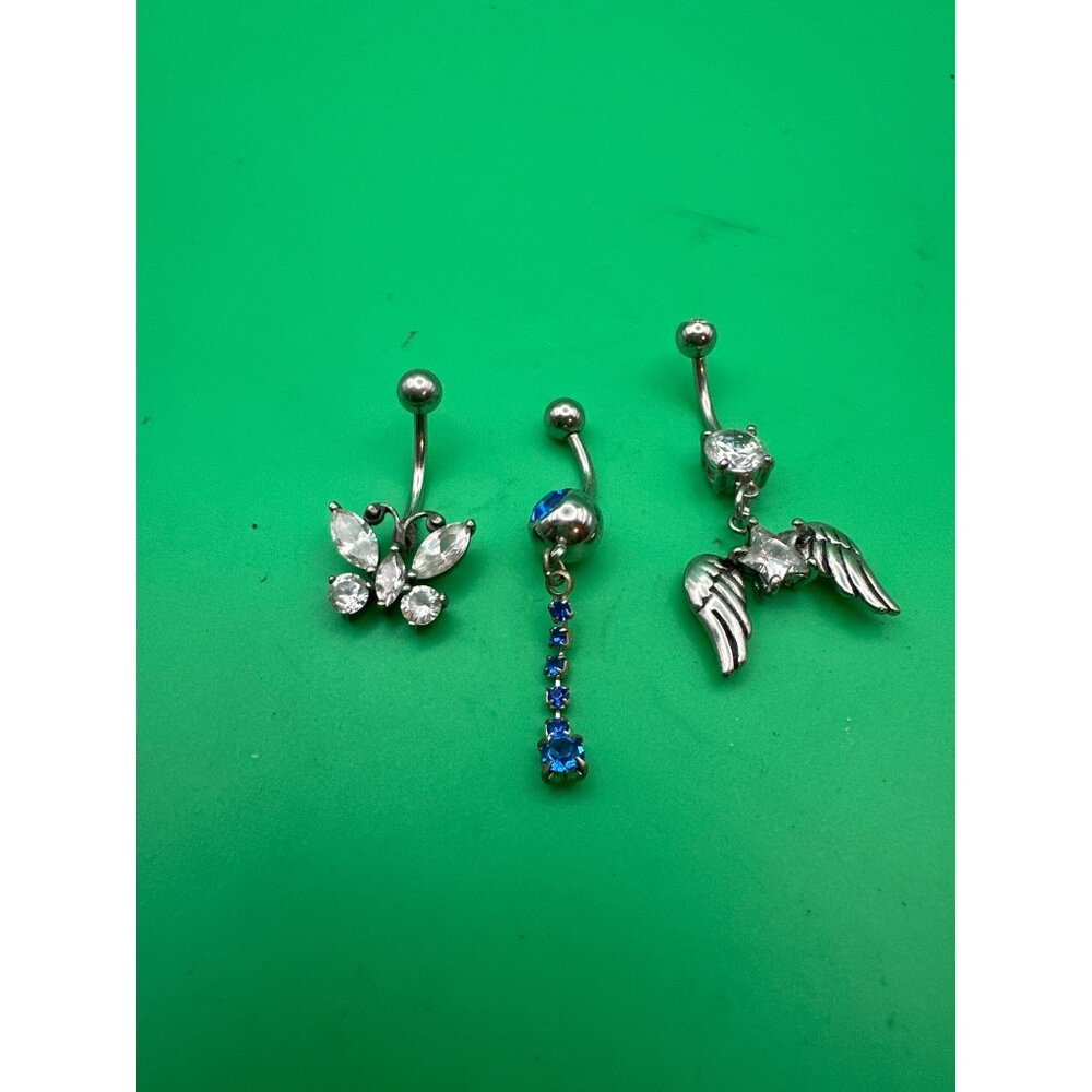 Lots of three bellybutton earrings